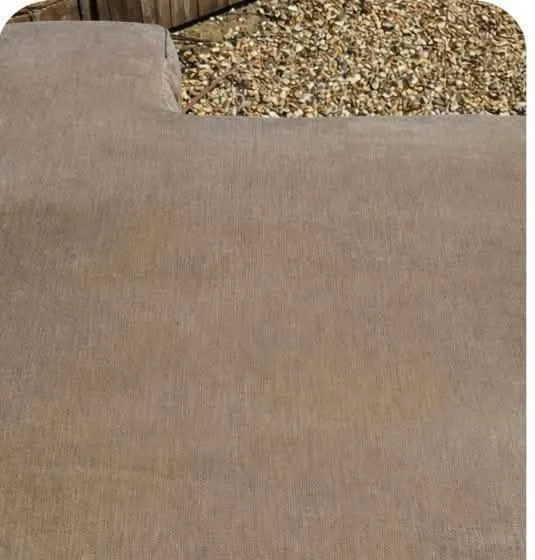 Cushion before cleaning, showing dirt and discolouration